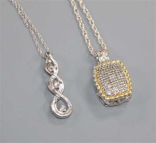 Two silver and diamond set pendants on chains.